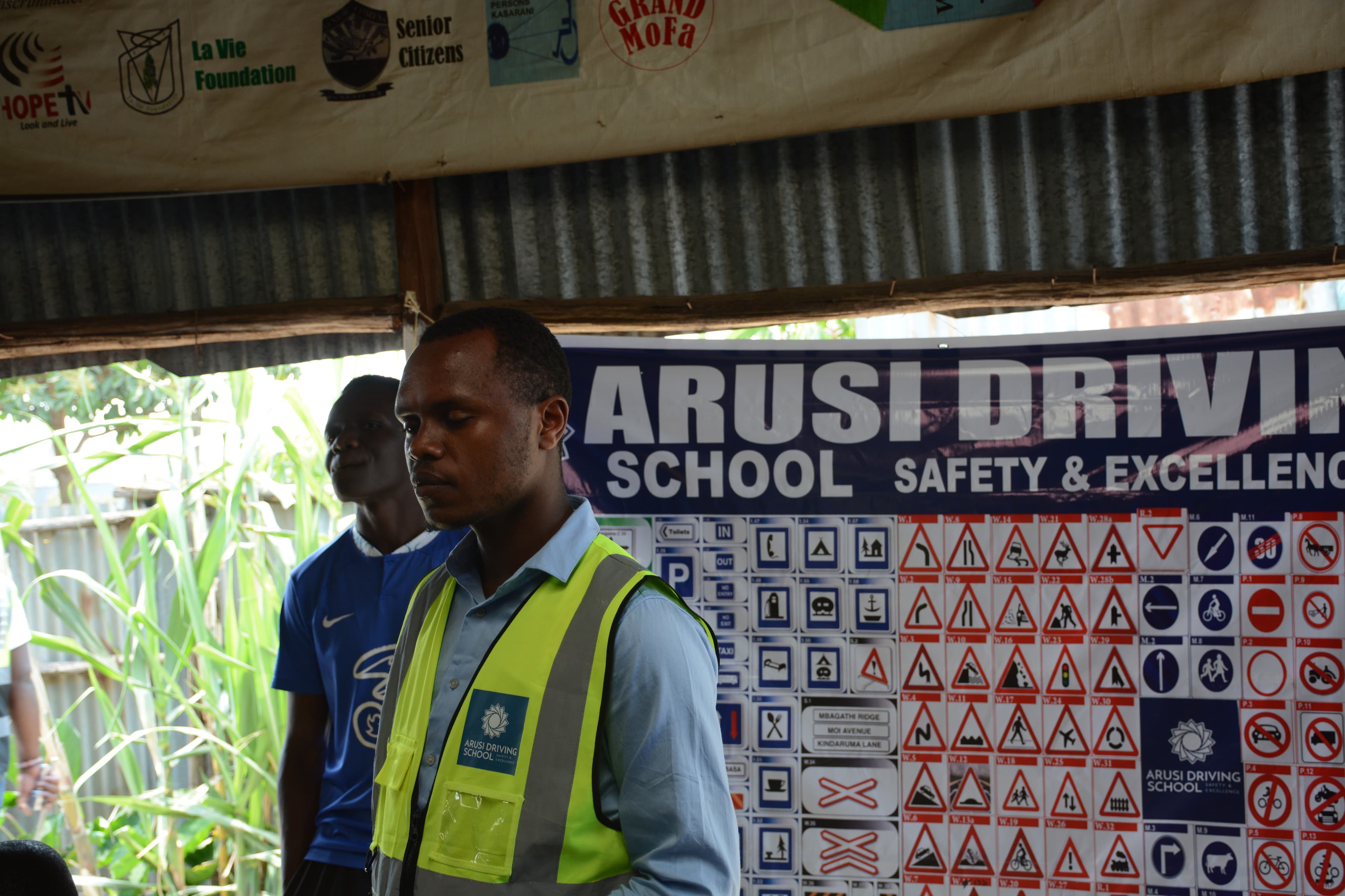 ARUSi instructor addressing motorcycle riders during a safety training session in Riruta.